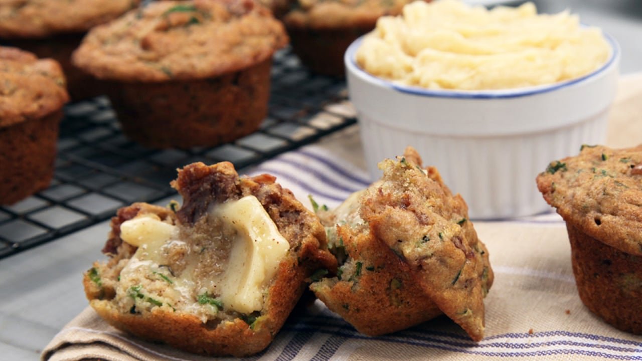 default-342 Closeup of a muffin with butter and more muffins in the background